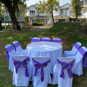 เช่าโต๊ะ-โต๊ะจีน1.5ม.+เก้าอี้พลาสติกคลุมผ้าสีขาว+โบว์สีม่วง
